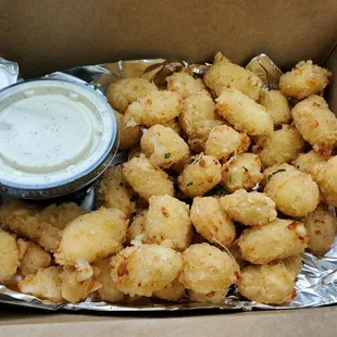 $9 cheese curds. They&apos;re medium-firm pillows of curds encased by light fried outer shell. Served w/ dill-infused ranch. I approve!