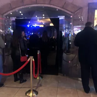 a crowd of people standing in line