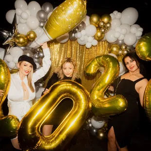 a group of women posing for a picture