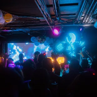 a crowd of people at a party