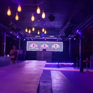 a stage with purple lighting