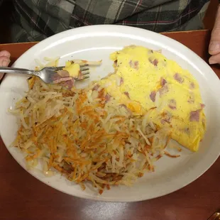 Spouse's ham and cheese omelette.  Cooked soft with American cheese - just like he likes it!  Great breakfast!