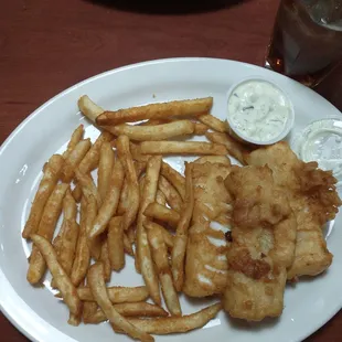 Steaming hot Fish and Chips.   Tender, flakey fish with crispy batter dipped fries.  Large portion!  Had a garden salad on the side.