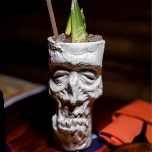 a close up of a skull cup