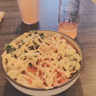 a plate of pasta and a glass of orange juice