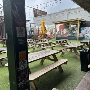 a picnic area with tables and umbrellas
