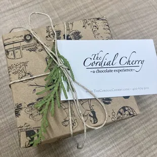 a gift wrapped in brown paper