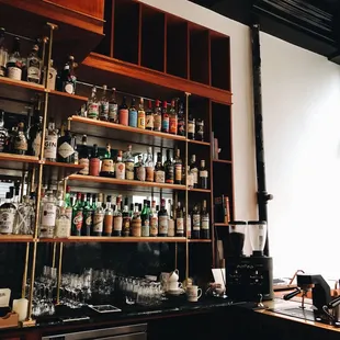 a shelf of liquor bottles