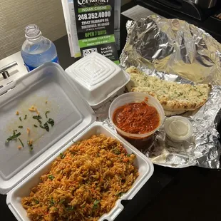 Tikka Masala, Vegetable Biryani both medium+ spice level and Garlic Naan. Delicious!