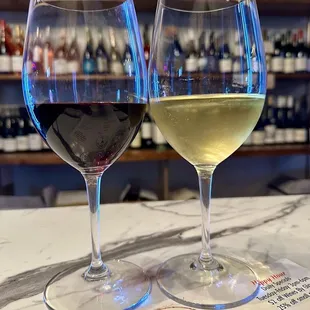 two glasses of wine on a table