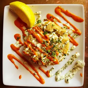 Jumbo Crab Cake with corn tortilla crust. Chile aoili &amp; cilantro crema. Superb gluten-free appetizer!