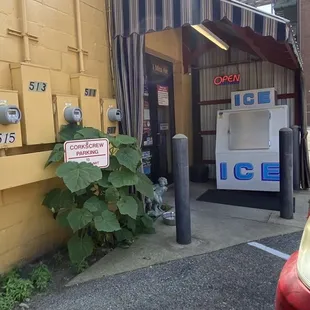 a soda machine in a parking lot