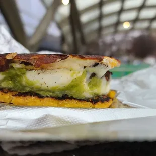 Cachapas, sweet corn cake filled with cheese, plantains and hot sauce.