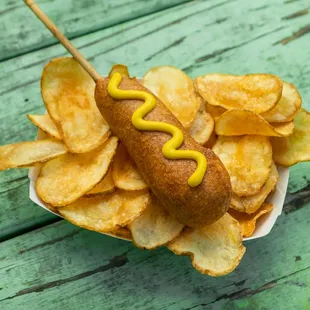 a hot dog with mustard on it