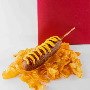 a hot dog with mustard on it