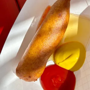 a hot dog with mustard and ketchup