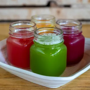 four jars of beet juice