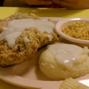 Chicken Fried Steak with a said of mashed potatoes and corn