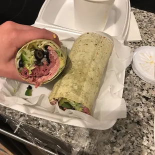 Look how big this pastrami roast beef wrap with provolone is.