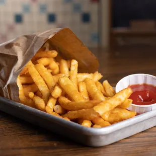 Bag of fries served with house ketchup