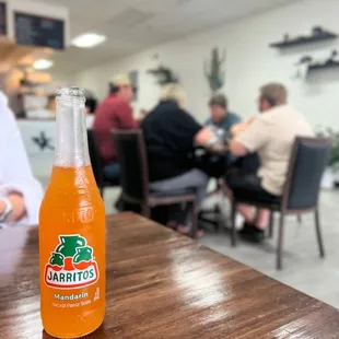 a bottle of orange soda