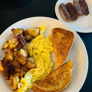 two plates of breakfast food on a table