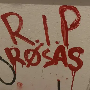 the writing rip rosas on the wall