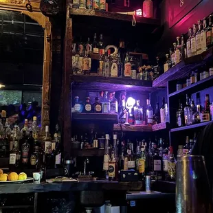 a bar with liquor bottles on the shelves