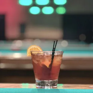 a drink with a slice of lemon