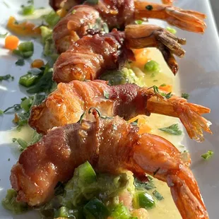 shrimp wrapped in bacon and vegetables