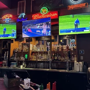 a bar with neon signs