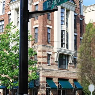 a street sign and a brick building
