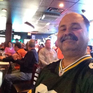 The only Packer Green and Gold in a room full of iBengal Orange and Black. Ah, the life of an NFL Owner.