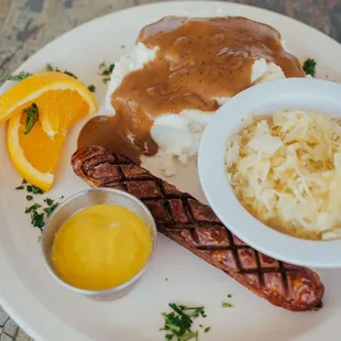 Bratwurst Sauerkraut and mashed potato and gravy