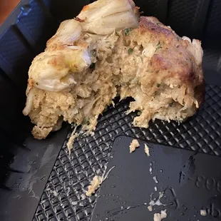 Half-eaten crab cake.