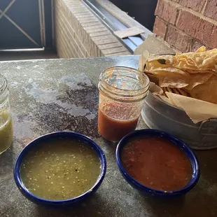 Two different salsas and corn tortilla chips