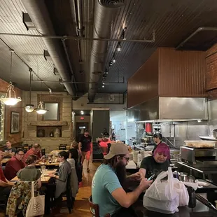 customers sitting at the bar