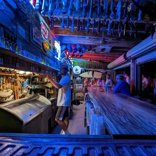 a man standing at the bar