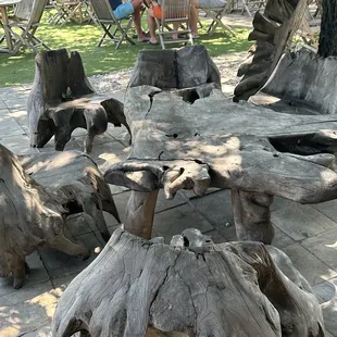 a table made out of tree stumps
