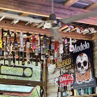 a ceiling full of beer bottles