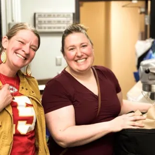 Staff member Julia Verby and owner Ellen Beier packing a corporate lunch delivery!