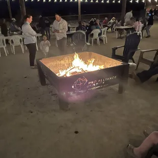 Multiple fire pits at night