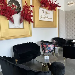 black velvet chairs and a gold coffee table