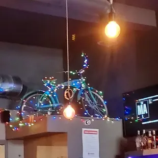 a bicycle decorated with christmas lights