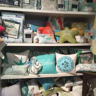 There are a lot of beautiful linens and fun throw pillows here.