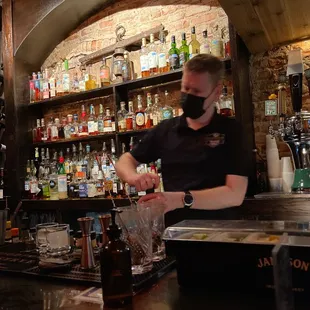 a bartender preparing a drink