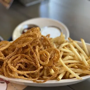 a plate of french fries and onion rings
