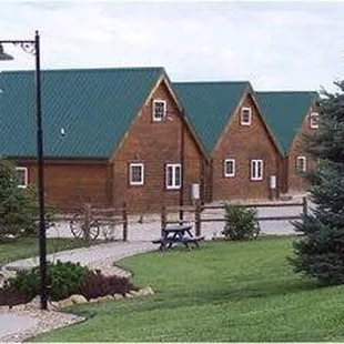 an american flag flying in front of the cabin