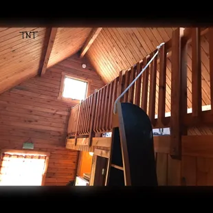a view of the stairs leading up to the loft