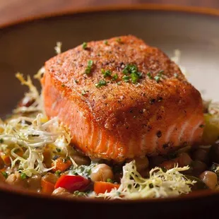 Seared Salmon. Delicious combination of chickpea and baby heirloom tomato ragout and subtle dill creme fraiche!